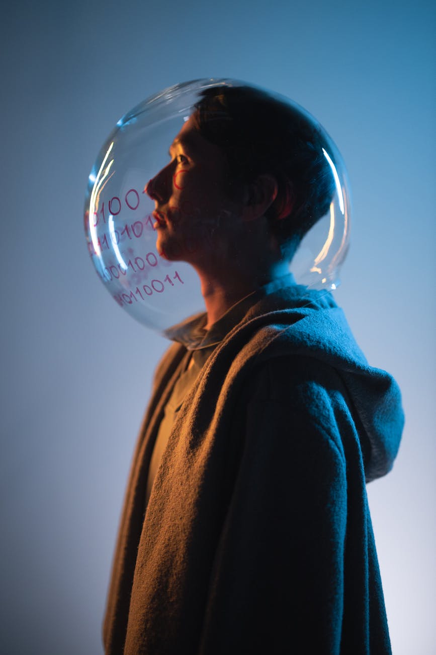 man with fish bowl on his head