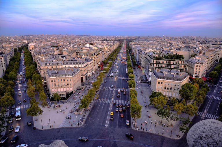 Stunning aerial photo of Paris showcasing the historic Champs-Élysées at dusk.
