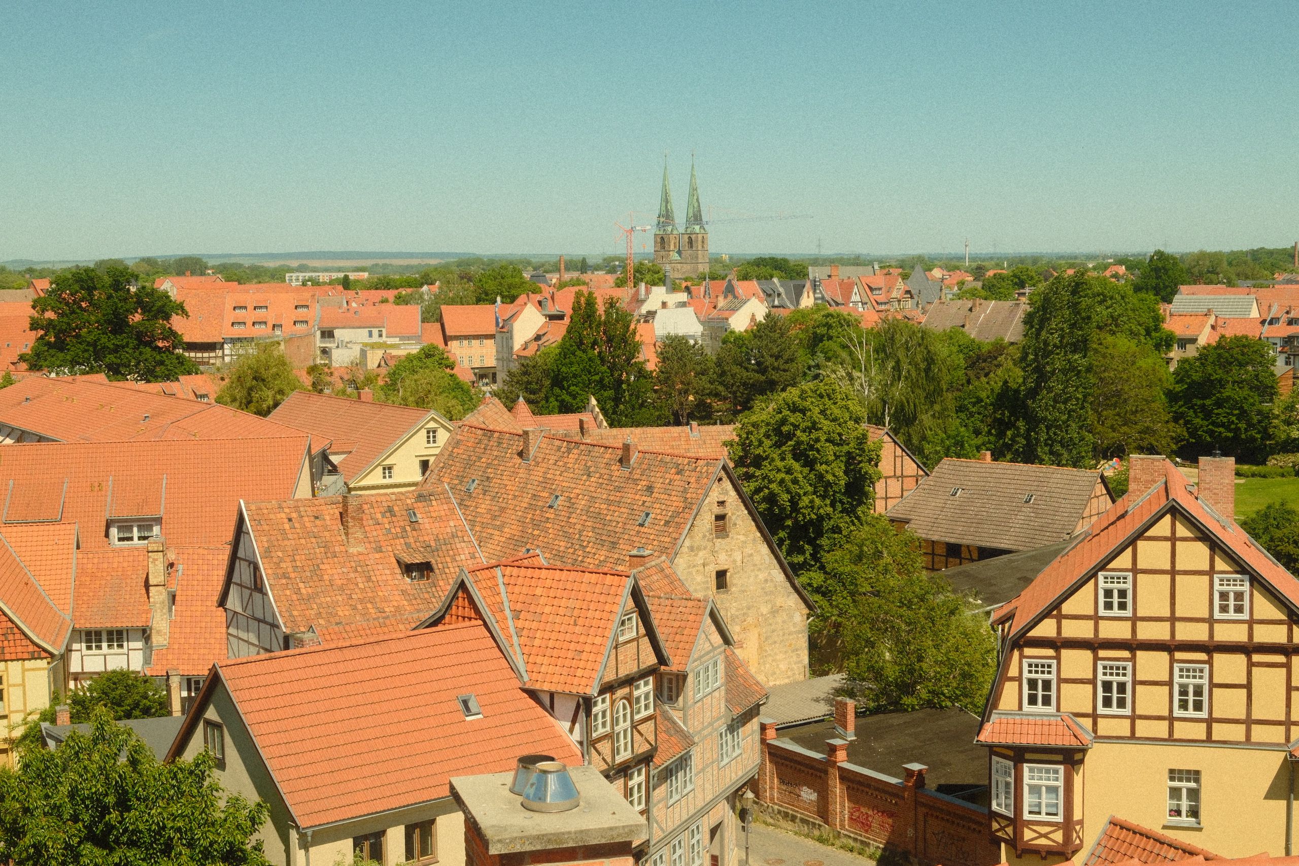 A picturesque view of Quedlinburg's historic German architecture with a distant church.